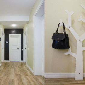 Black bag on a white hanger in the form of a tree