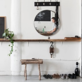 Wooden shelf on a light wall