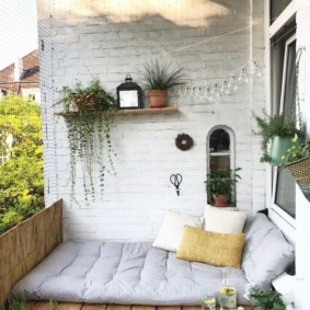 Sleeping bed on a spacious balcony