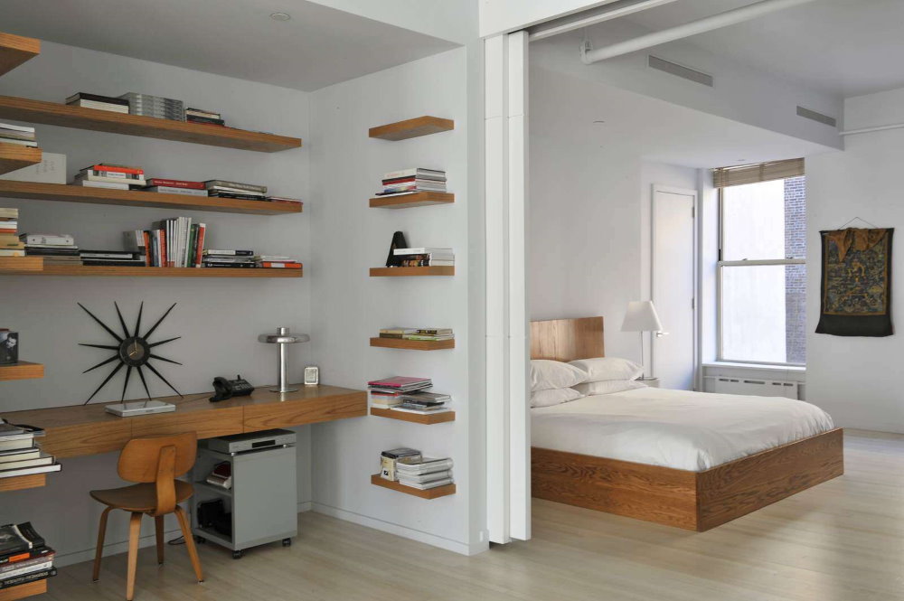 Books on open shelves in the study-bedroom