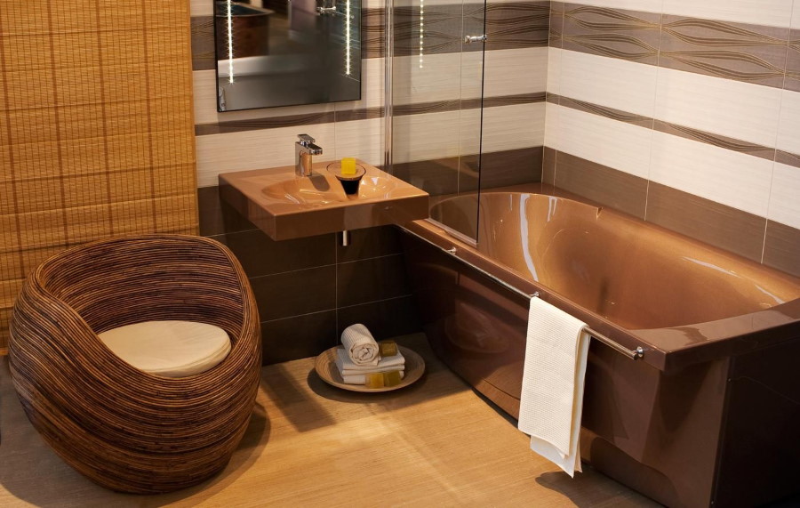 Brown acrylic bathtub with towel rail