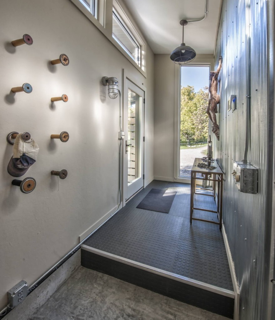 Galvanized metal on the wall of a narrow corridor in a private house