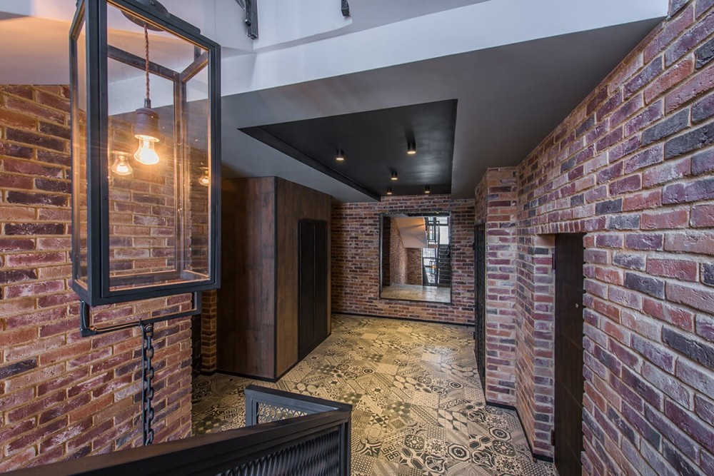 wallpaper under a brick in the hallway design ideas