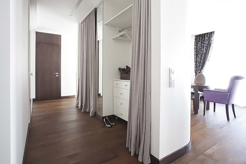 Gray curtains in the lobby of a modern apartment