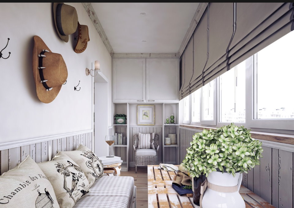 Interior of a furnished balcony with roman blinds