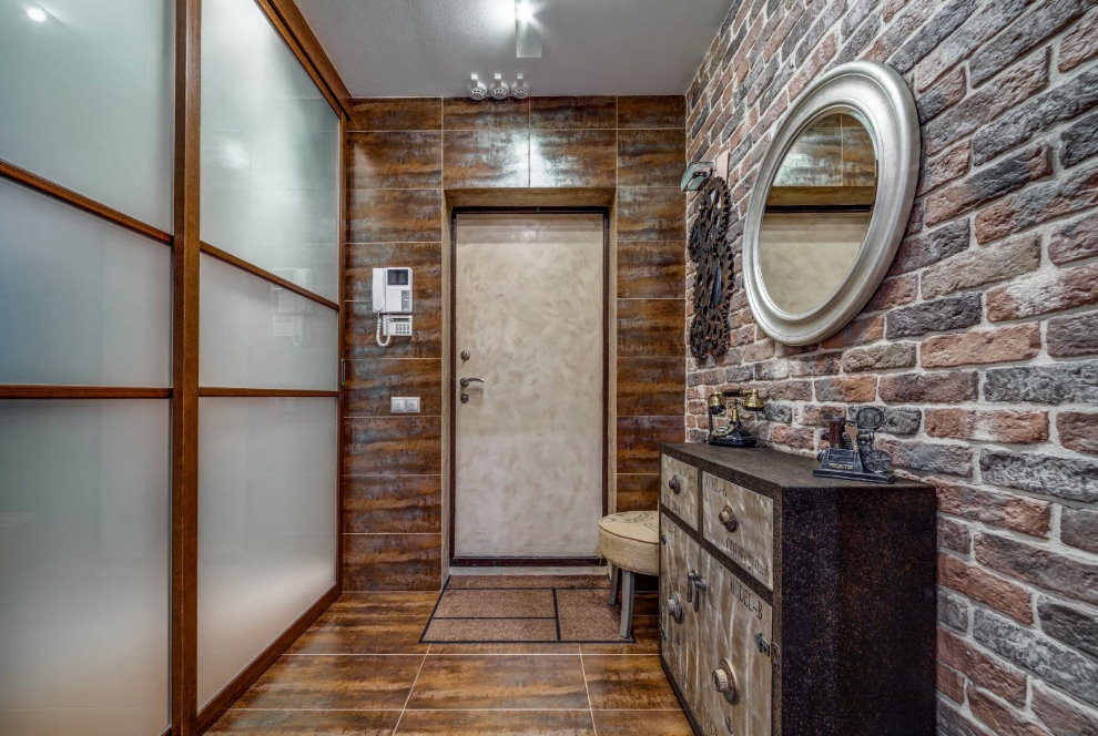 Round mirror on a brick wall