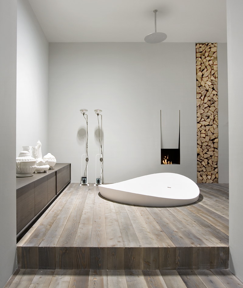 Built-in acrylic bathtub in a wooden podium