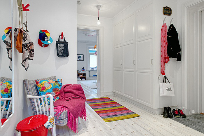 Bright rug on the bright floor in the hallway