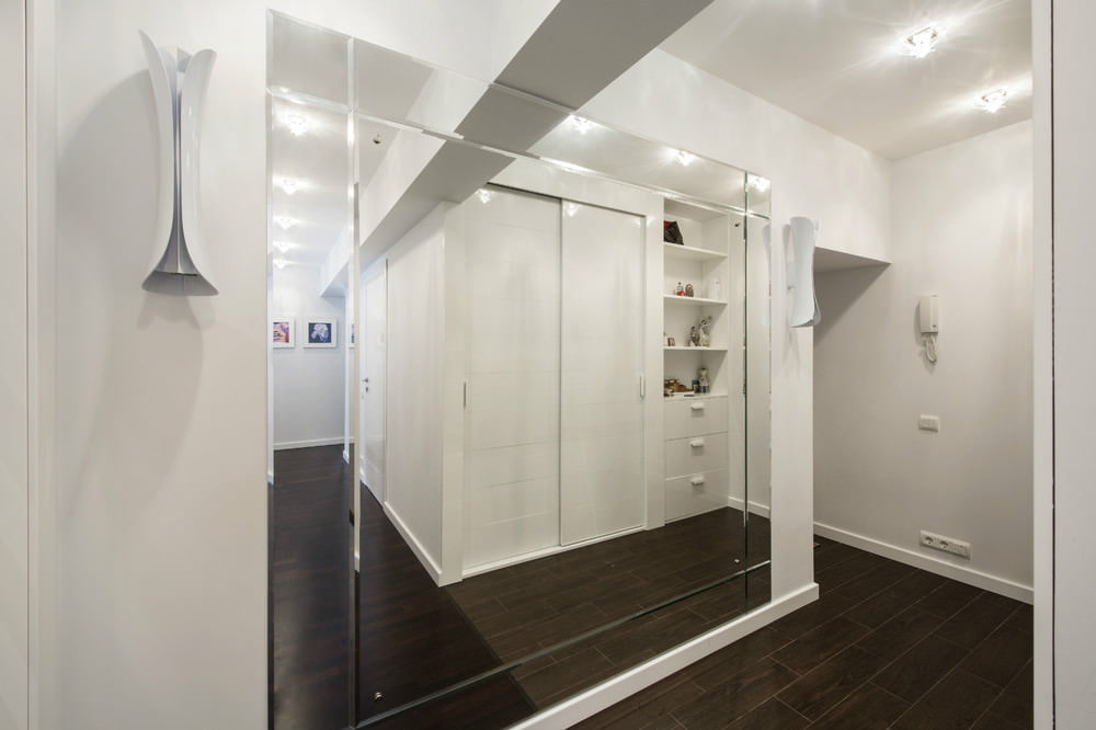 Mirrored wall in a narrow hallway