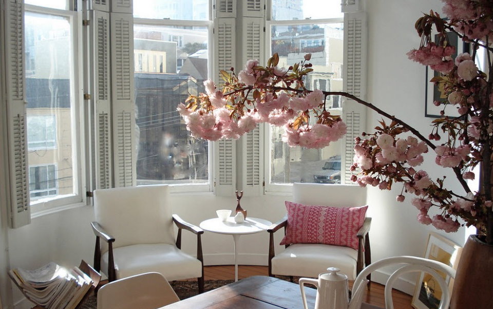 Place for tea in the bay window of a living room of a multi-storey building