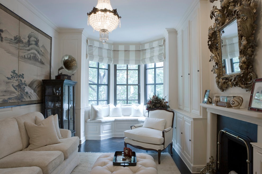 Small sofa in the bay window of the living room of a private house