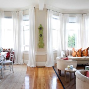 White curtains in light tulle floor length