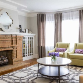 Brick fireplace in the room with bay window