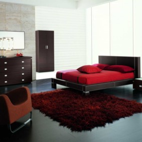 burgundy rug in the bedroom