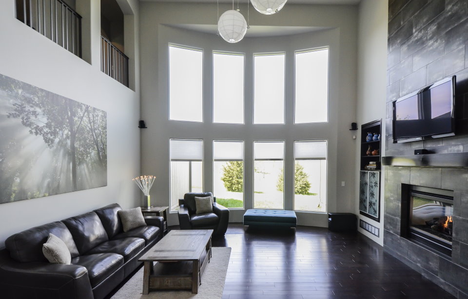 Dark floor in living room with high bay window