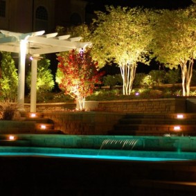 Wooden pergola in the night garden