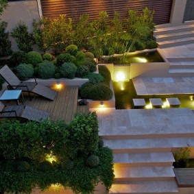 Garden sun loungers on a wooden platform