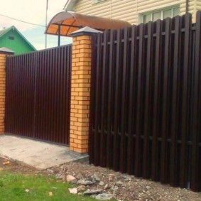 Blind fence made of painted picket fence