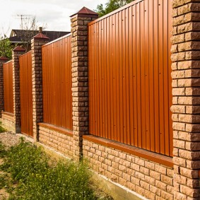 Profiled sheet fence under a natural tree