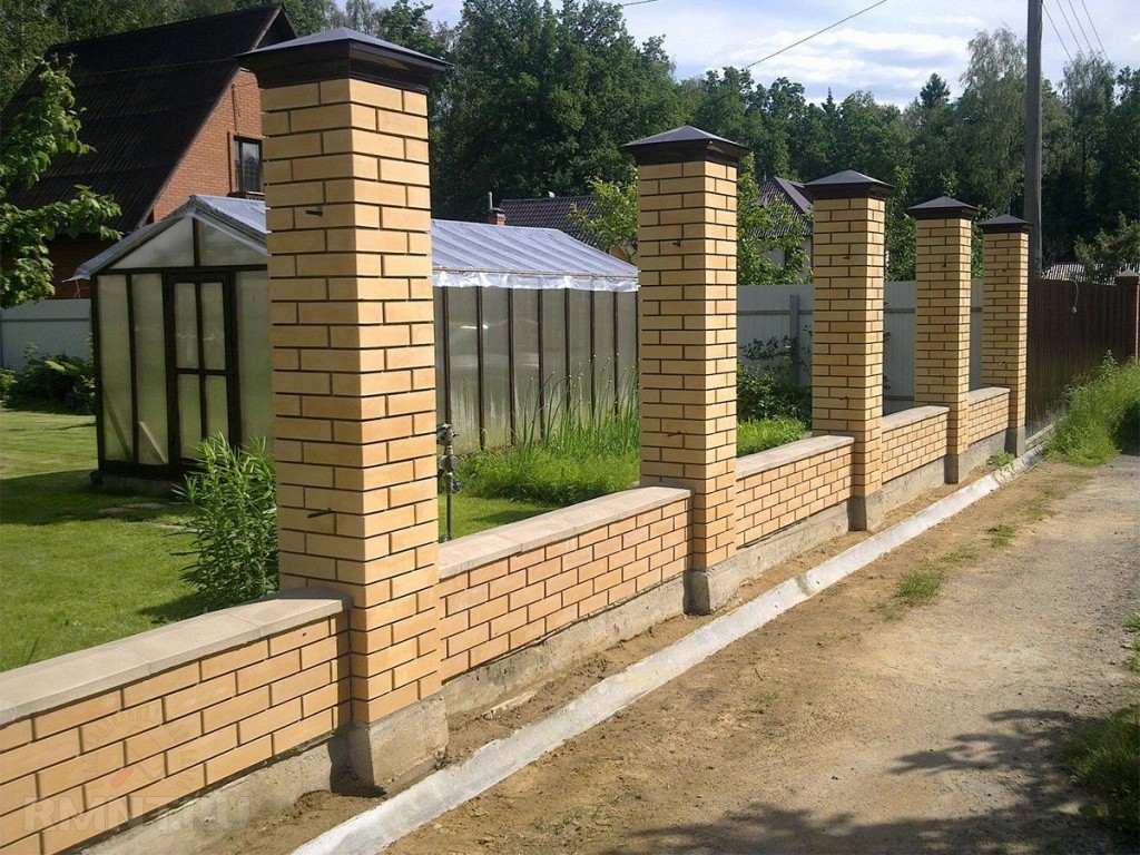 Brick fence posts around the perimeter of the site