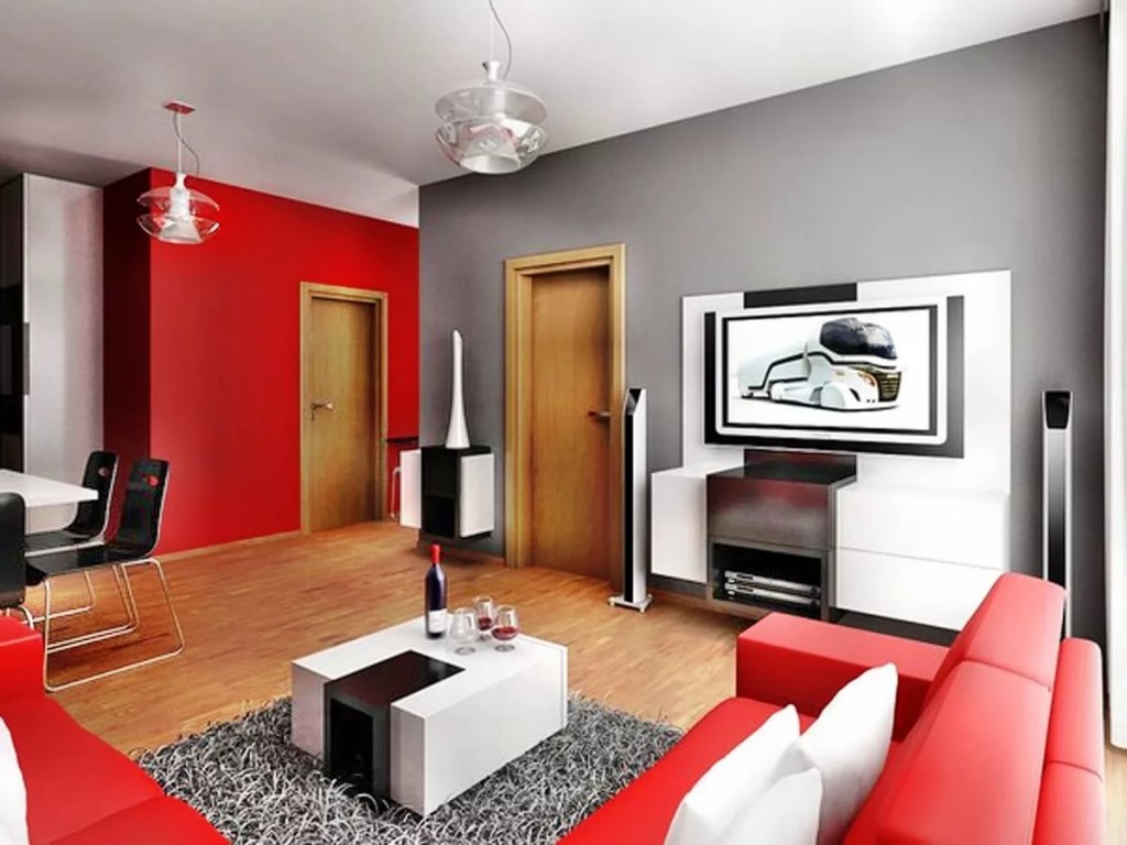 Red sofa in a room with a gray wall