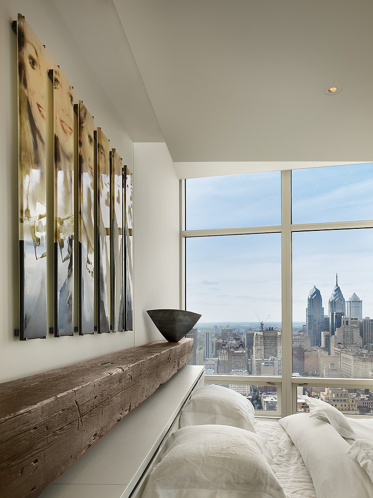 Modern bedroom interior with large window.