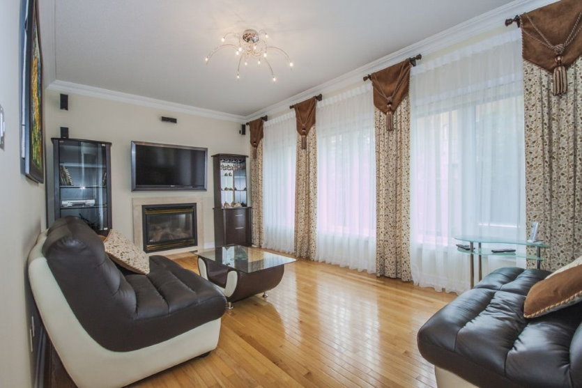 Brown fabric pelmet on the living room windows