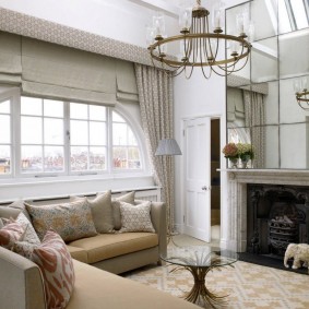 Mirror panel above the fireplace in the hall