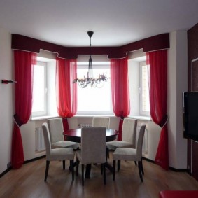 Red curtains on the bay window