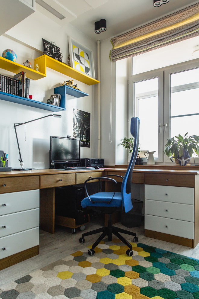 Corner computer desk in the nursery for the boy