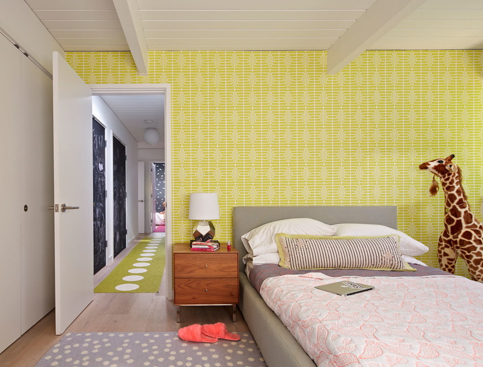 Yellow wallpaper in the interior of the room for a boy