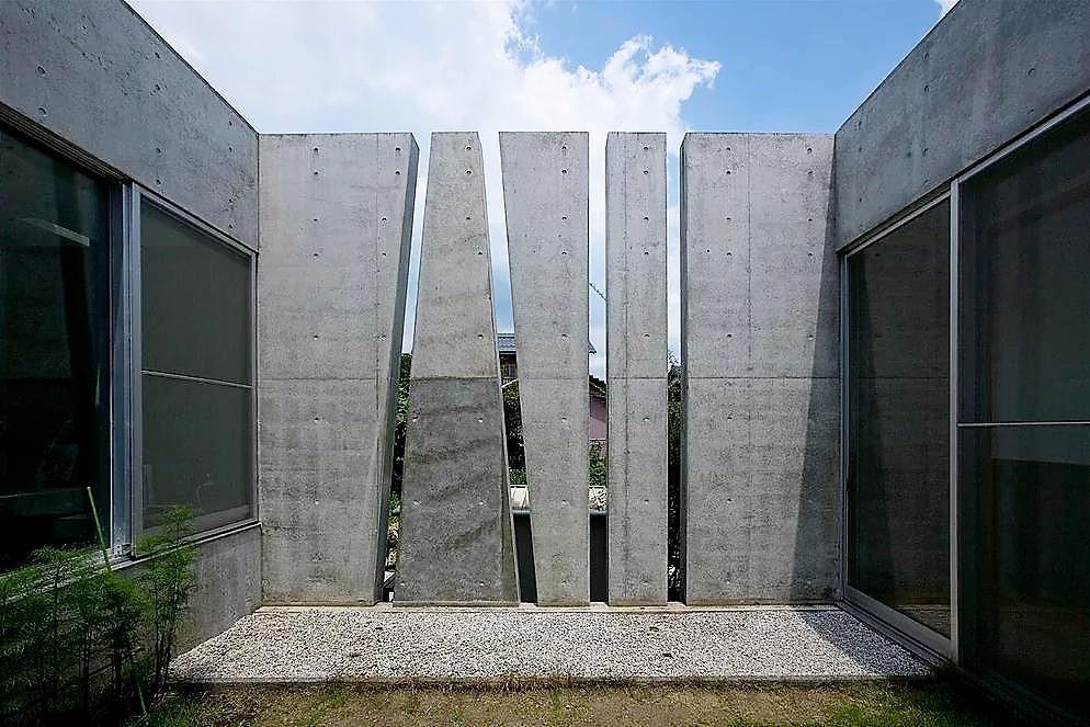 Concrete steles on a hi-tech garden plot