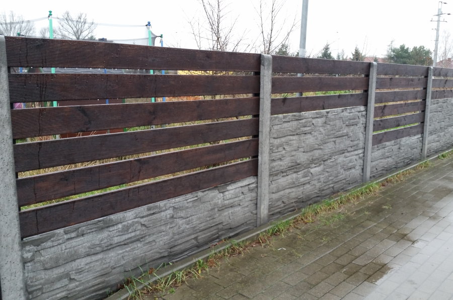 Wooden fence on a concrete base