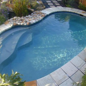 Square tile around the oval pool