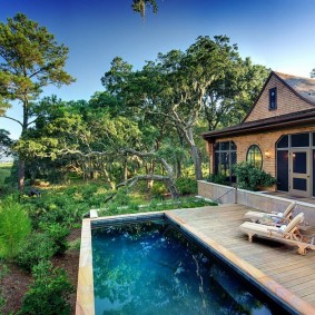 Wooden platform near the rectangular pool