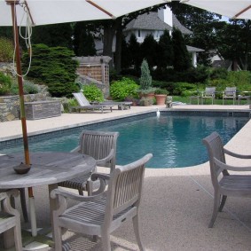 Wooden furniture by the pool