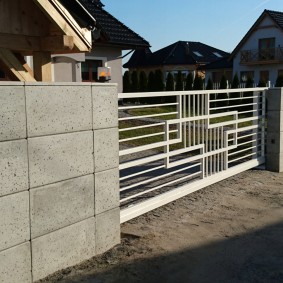 Metal gates on concrete poles