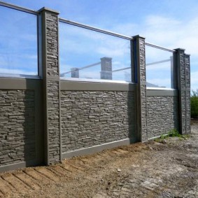 Polycarbonate at the top of the concrete fence