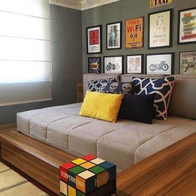 Gray mattress on a wooden podium