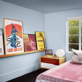 Wooden shelf for posters in the nursery