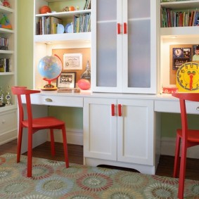 Red chairs near a white table