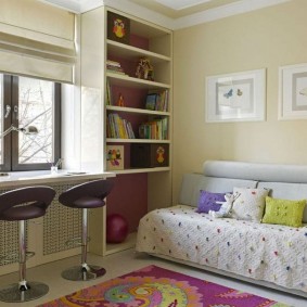 Bar stools in front of a nursery window