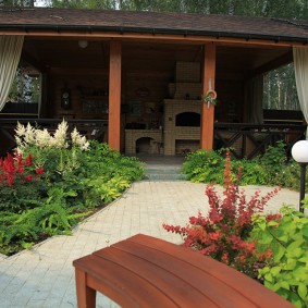 Half open gazebo on wooden poles