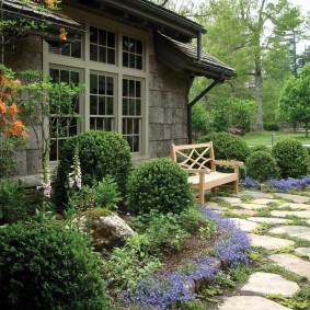 Wooden bench near the wall of a country house