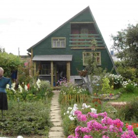 Homemade scarecrow in garden beds