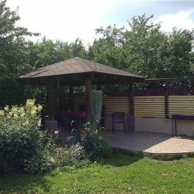 Garden arbor in the far corner of the cottage