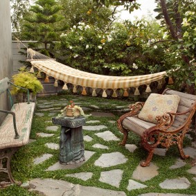 An old bench in the yard of a summer cottage