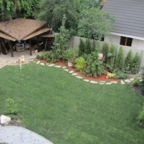 Arbor in the far corner of the cottage