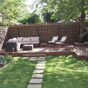 Wooden fencing of the relaxation area in the garden