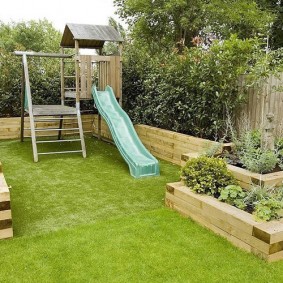 Children's slide in the play area of ​​the garden